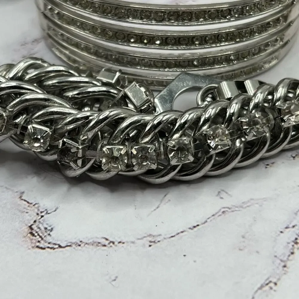 Set of 11 silver and gold tone bracelets